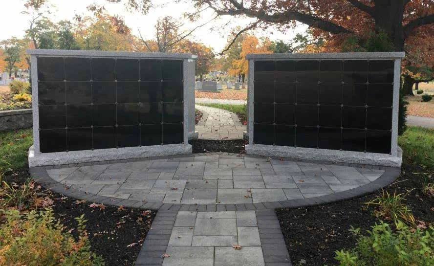 24 niche columbaria facing each other across a stone walkway